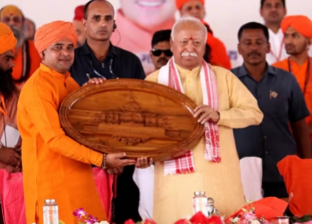Presented with a keepsake by RSS chief Mohan Bhagwat (2023)